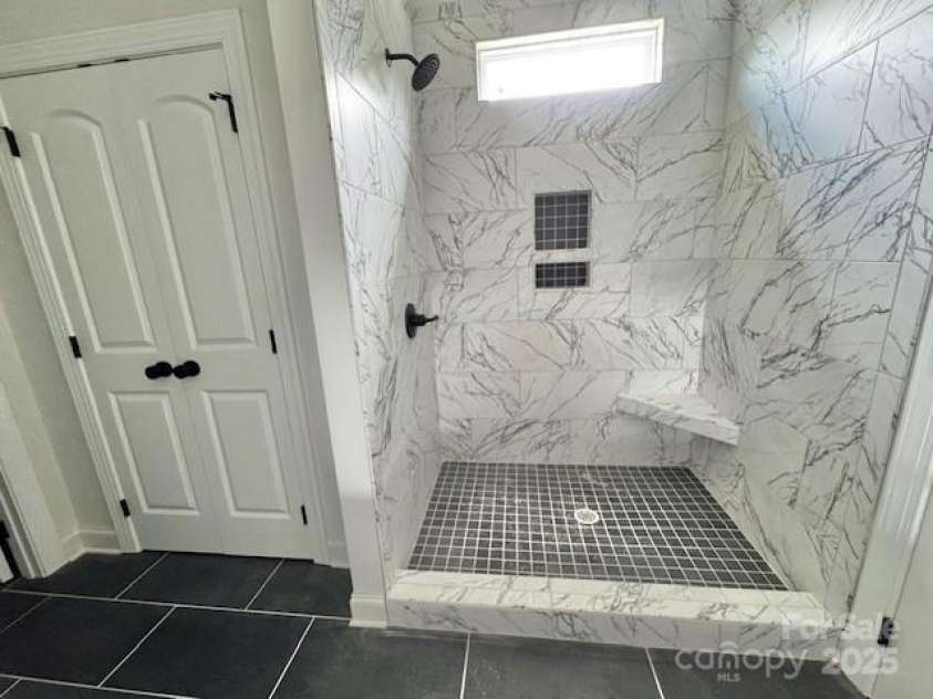 414 Westview Street, Gastonia, NC 28052.  MLS# CAR4276991, YatesRealty ID 23985. Walk in Tiled Shower and Linen closet Primary Bath