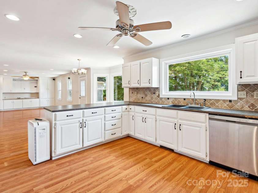 5632 Zion Church Road, Concord, NC 28025.  MLS# CAR4270566, YatesRealty ID 23988. Open kitchen, breakfast area, and living room.
