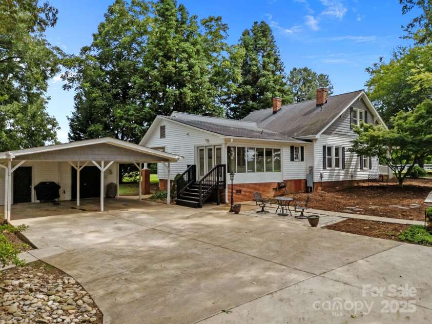 8900 Old Concord Road, Salisbury, NC 28146.  MLS# CAR4295325, YatesRealty ID 2399. Sunroom and detached carport