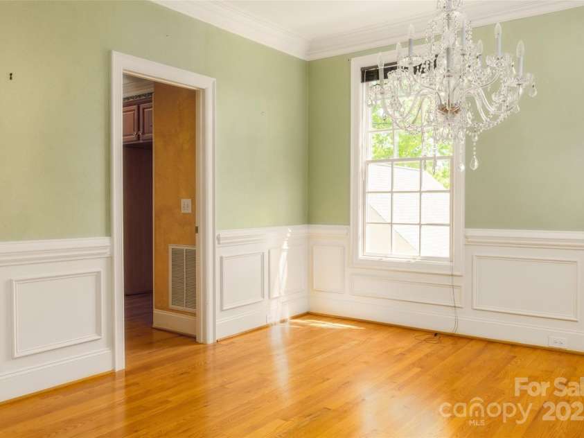 19113 Southport Drive, Cornelius, NC 28031.  MLS# CAR4242642, YatesRealty ID 23990. Dining Room with Crystal Chandelier at front entrance
