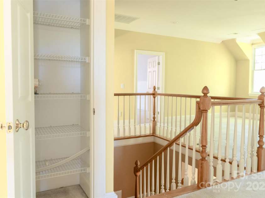 19113 Southport Drive, Cornelius, NC 28031.  MLS# CAR4242642, YatesRealty ID 23990. Sitting area and storage in loft