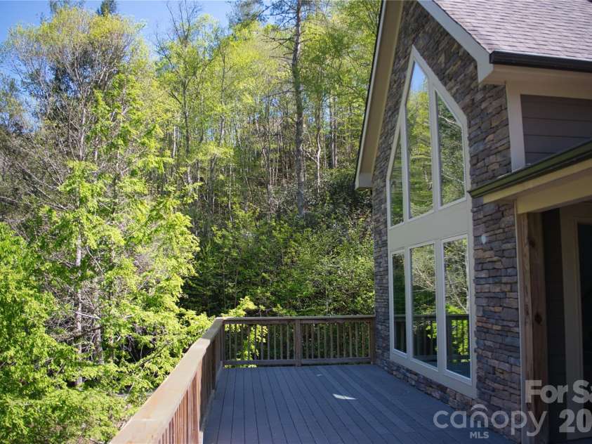 48 Back River Trail, Marshall, NC 28753.  MLS# CAR4362333, YatesRealty ID 23990. Large main level deck for entertaining