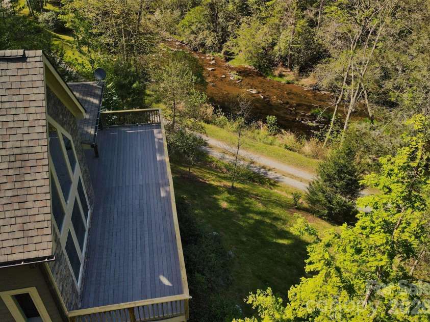48 Back River Trail, Marshall, NC 28753.  MLS# CAR4362333, YatesRealty ID 23990. Overlooking Big Laurel Creek