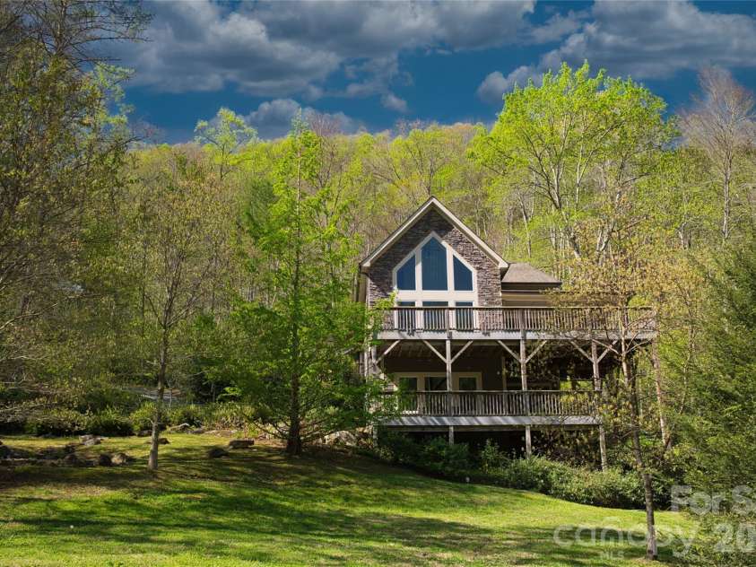 48 Back River Trail, Marshall, NC 28753.  MLS# CAR4362333, YatesRealty ID 23990. Spacious open yard surrounded by nature