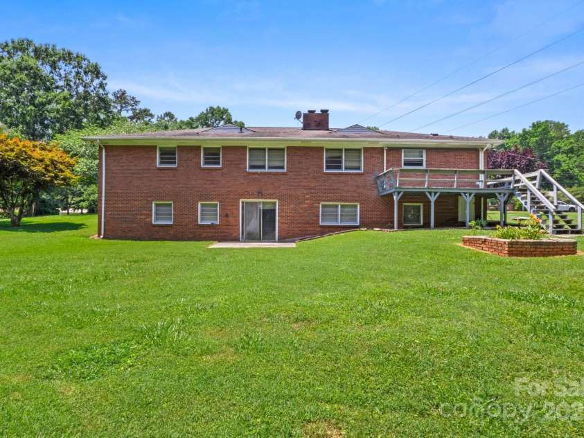 128 Howie Street, Mount Holly, NC 28120.  MLS# CAR4272463, YatesRealty ID 23991. Back of house