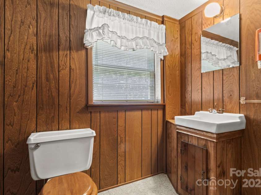 128 Howie Street, Mount Holly, NC 28120.  MLS# CAR4272463, YatesRealty ID 23991. Basement 1/2 Bath