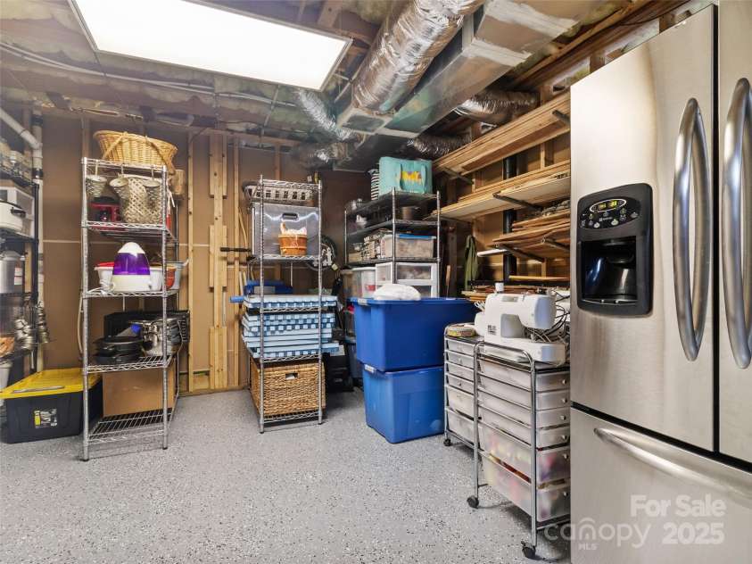 83 Roland Street, Burnsville, NC 28714.  MLS# CAR4228436, YatesRealty ID 2400. Basement storage