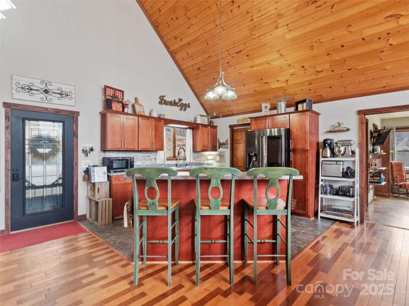 83 Roland Street, Burnsville, NC 28714.  MLS# CAR4228436, YatesRealty ID 2400. Kitchen w/breakfast bar