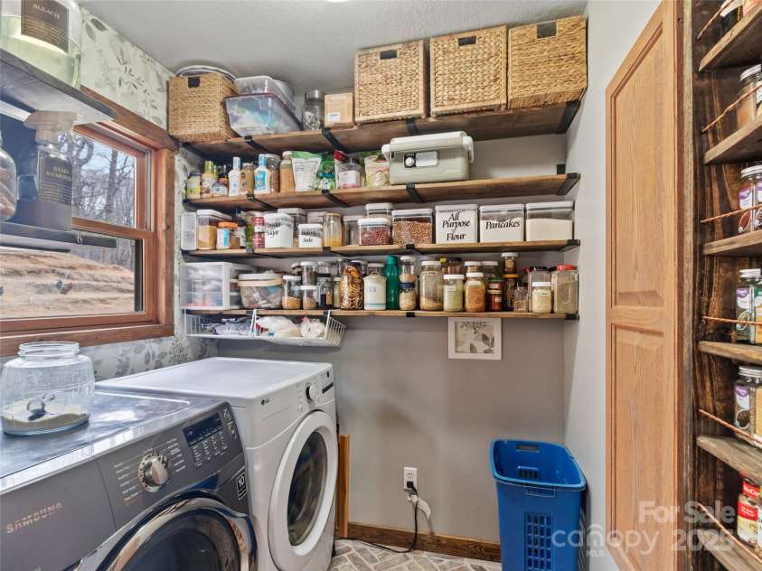83 Roland Street, Burnsville, NC 28714.  MLS# CAR4228436, YatesRealty ID 2400. Laundry & walk-in pantry adjacent to kitchen