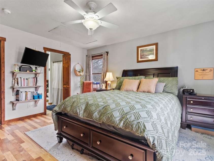 83 Roland Street, Burnsville, NC 28714.  MLS# CAR4228436, YatesRealty ID 2400. Primary bedroom