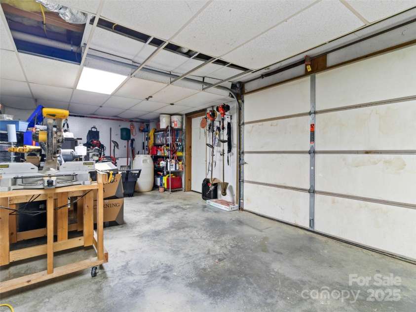 83 Roland Street, Burnsville, NC 28714.  MLS# CAR4228436, YatesRealty ID 2400. Workshop in basement