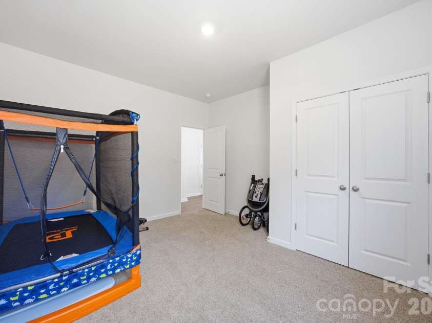 3016 Platinum Pointe Drive, Charlotte, NC 28227.  MLS# CAR4369367, YatesRealty ID 24001. 1st Floor Bedroom   being used as a playroom