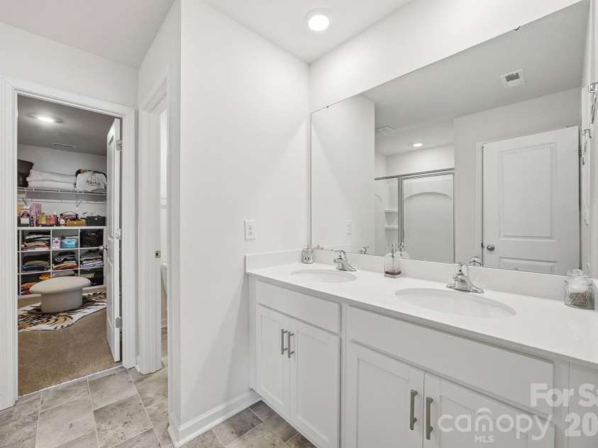 3016 Platinum Pointe Drive, Charlotte, NC 28227.  MLS# CAR4369367, YatesRealty ID 24001. Primary bathroom has dual sink vanity