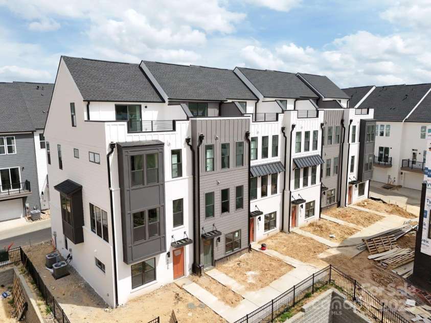 6005 Countess Drive, Charlotte, NC 28217.  MLS# CAR4249197, YatesRealty ID 24002. Enjoy Luxury Living Modern Design New Townhomes With Rooftop Terraces