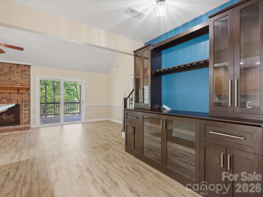 9437 Fairmead Drive, Charlotte, NC 28269.  MLS# CAR4368697, YatesRealty ID 24004. Bar or coffee bar off of the kitchen with pantry shelves 