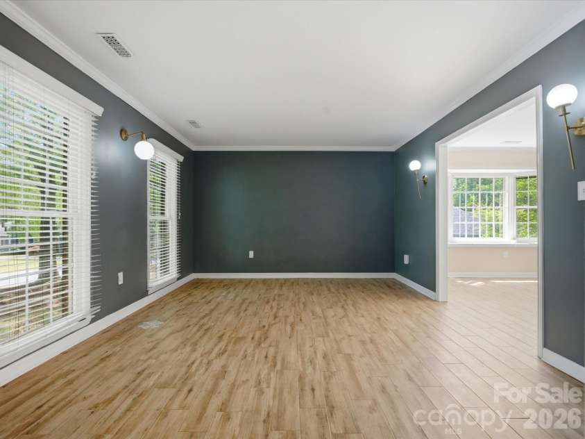 9437 Fairmead Drive, Charlotte, NC 28269.  MLS# CAR4368697, YatesRealty ID 24004. Front room open to the grand Foyer and dining room 