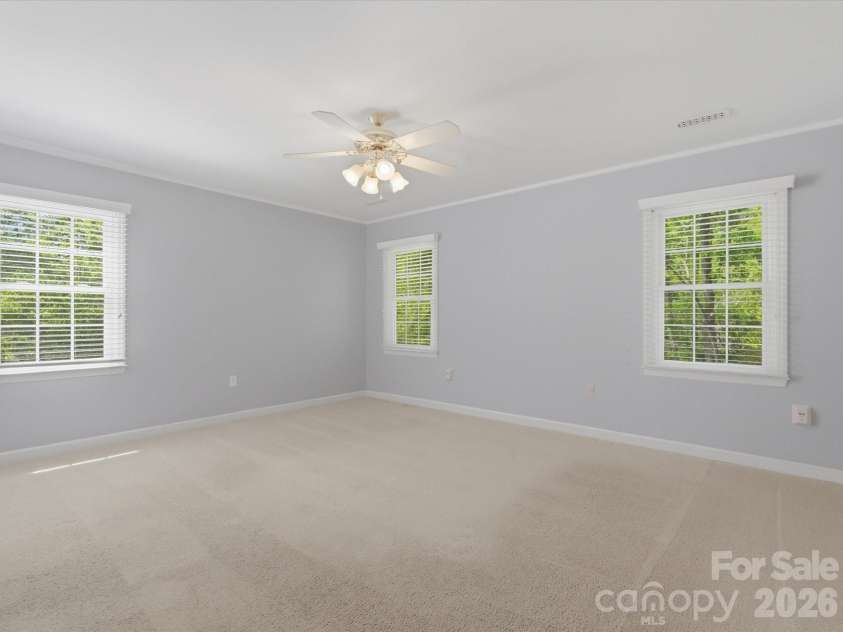 9437 Fairmead Drive, Charlotte, NC 28269.  MLS# CAR4368697, YatesRealty ID 24004. Spacious Primary bedroom 