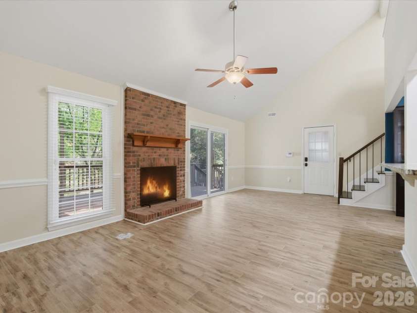 9437 Fairmead Drive, Charlotte, NC 28269.  MLS# CAR4368697, YatesRealty ID 24004. Two story great room open to the kitchen 
