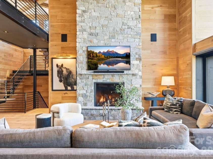 270 Osprey Drive, Banner Elk, NC 28604.  MLS# CAR4373242, YatesRealty ID 24006. Soaring stone fireplace
