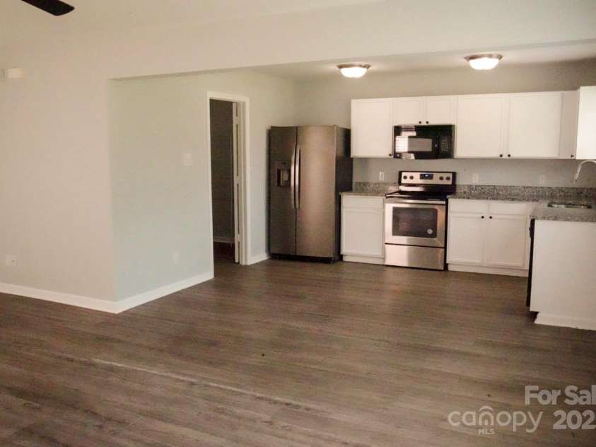 7619 Monarch Birch Lane, Charlotte, NC 28215.  MLS# CAR4273922, YatesRealty ID 24006. Living Room / Kitchen