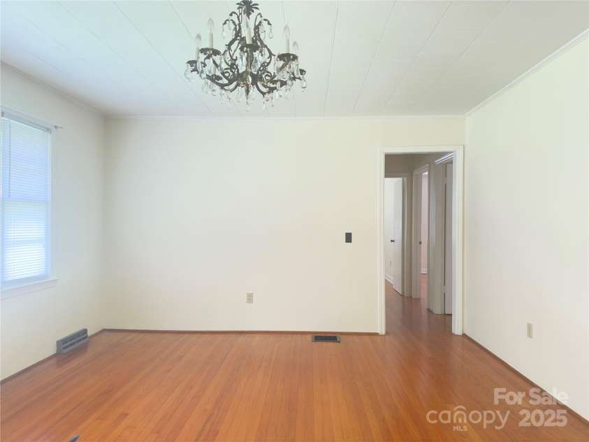 30 Cypress Road, Marion, NC 28752.  MLS# CAR4273463, YatesRealty ID 24007. Living Room w/ natural light and beautiful hardwood floors