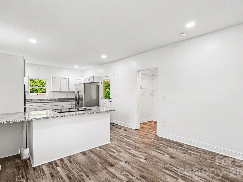 405 Aquadale Road, Albemarle, NC 28001.  MLS# CAR4383064, YatesRealty ID 24011. Dining Room into Kitchen