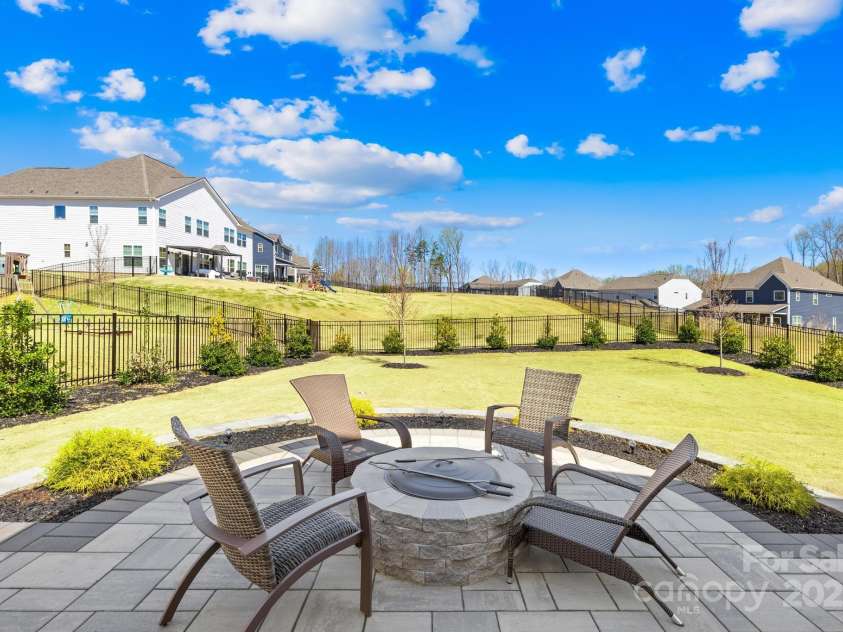 7313 Glenroe Drive, Huntersville, NC 28078.  MLS# CAR4239222, YatesRealty ID 24016. Custom outdoor stamped concrete area w/fire pit