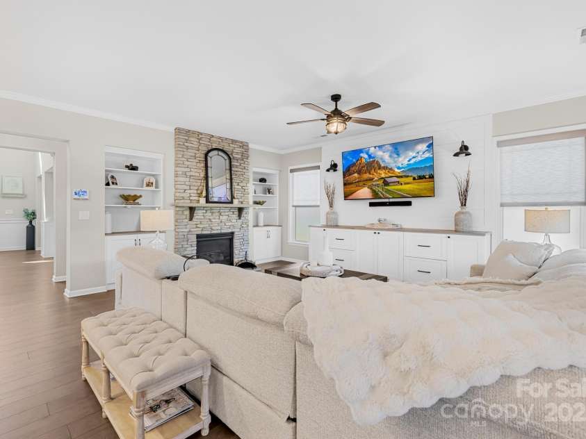 7313 Glenroe Drive, Huntersville, NC 28078.  MLS# CAR4239222, YatesRealty ID 24016. Den w/stone front fireplace & built-ins
