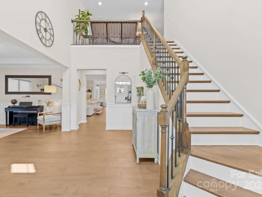 7313 Glenroe Drive, Huntersville, NC 28078.  MLS# CAR4239222, YatesRealty ID 24016. Staircase w/wrought-iron spindles
