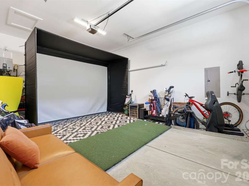 931 Cornelius Road, Mooresville, NC 28117.  MLS# CAR4378236, YatesRealty ID 24017. 3rd bay garage used for golf simulator