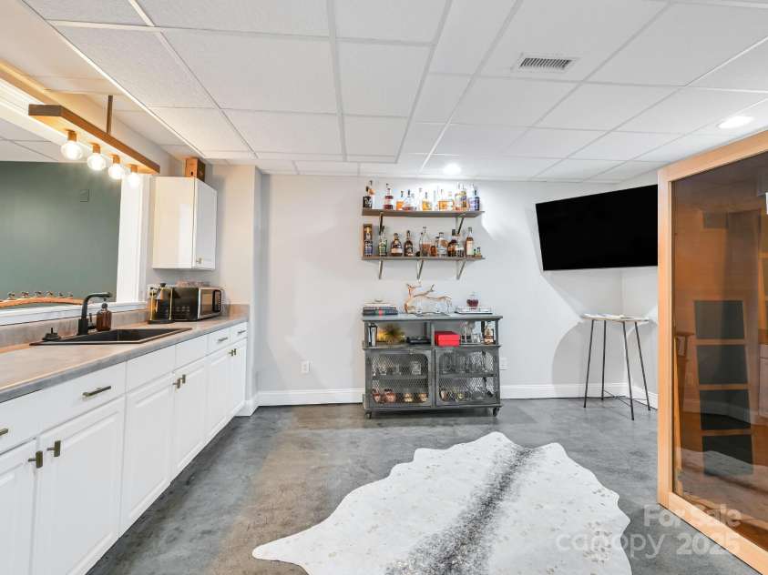 35 White Ash Drive, Asheville, NC 28803.  MLS# CAR4255921, YatesRealty ID 24020. Basement Kitchen