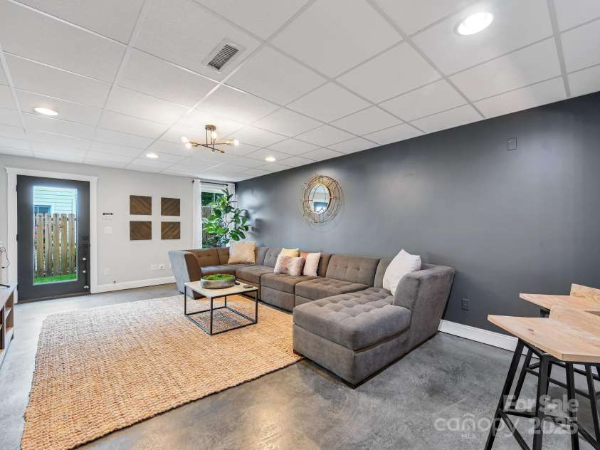 35 White Ash Drive, Asheville, NC 28803.  MLS# CAR4255921, YatesRealty ID 24020. Basement Living Room