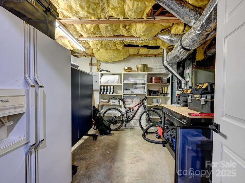 35 White Ash Drive, Asheville, NC 28803.  MLS# CAR4255921, YatesRealty ID 24020. Basement storage