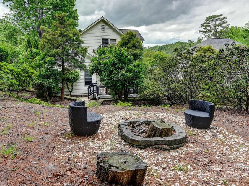 35 White Ash Drive, Asheville, NC 28803.  MLS# CAR4255921, YatesRealty ID 24020. Firepit area looking at the back of house