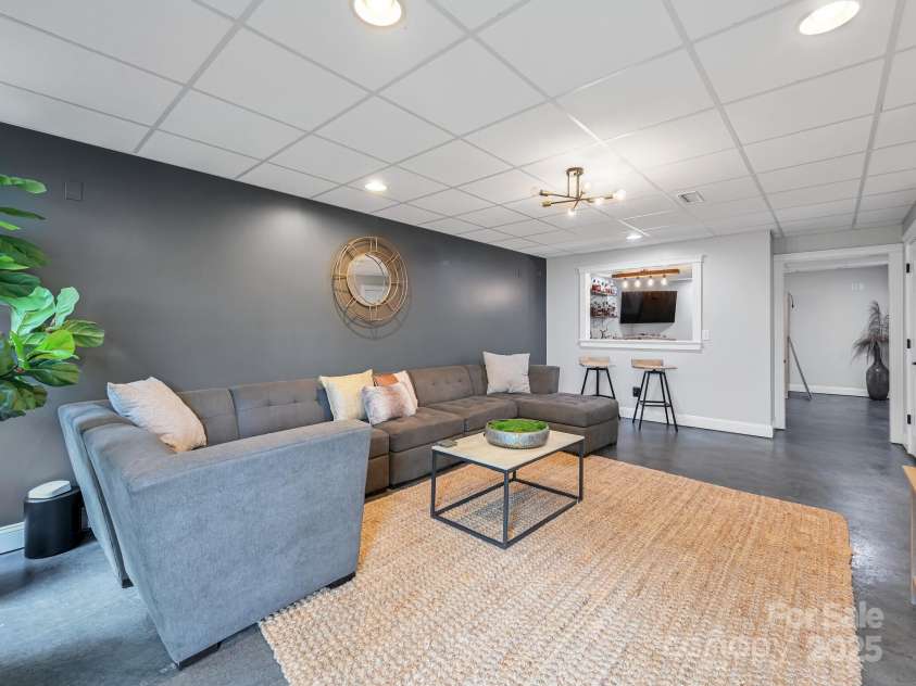 35 White Ash Drive, Asheville, NC 28803.  MLS# CAR4255921, YatesRealty ID 24020. Living Room Basement