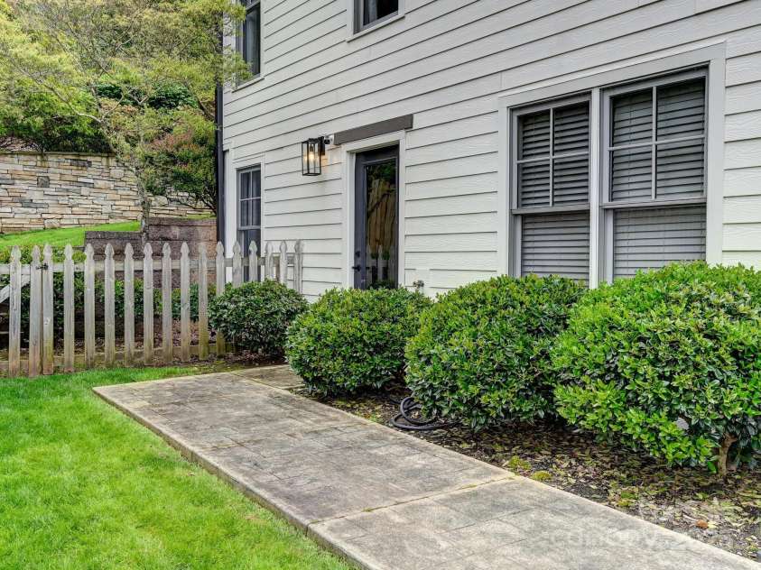 35 White Ash Drive, Asheville, NC 28803.  MLS# CAR4255921, YatesRealty ID 24020. Paved Walkway to basement entrance