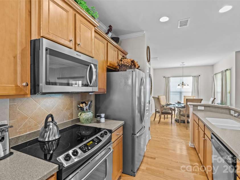 33124 Tanager Court, Fort Mill, SC 29707.  MLS# CAR4276689, YatesRealty ID 24021. Kitchen open to living space