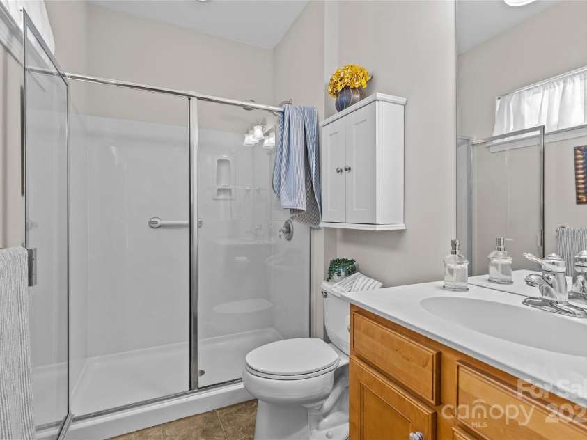 33124 Tanager Court, Fort Mill, SC 29707.  MLS# CAR4276689, YatesRealty ID 24021. Primary bath with glass shower