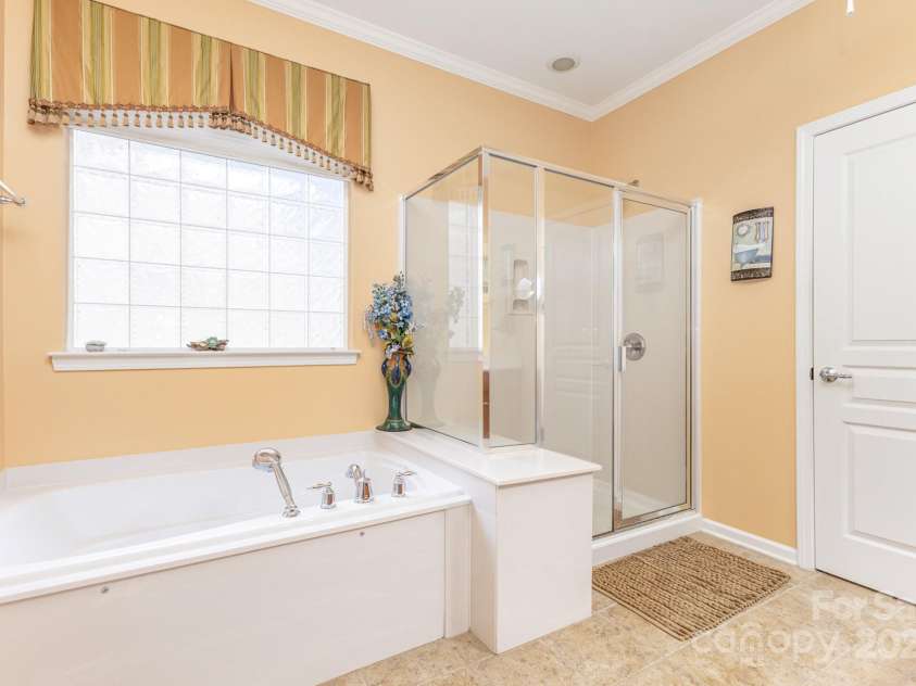 52095 Longspur Lane, Indian Land, SC 29707.  MLS# CAR4276043, YatesRealty ID 24022. Primary Bathroom with Shower and Garden Tub