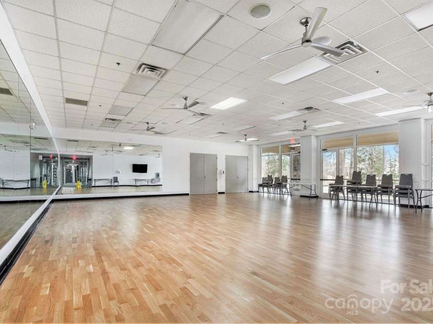 52095 Longspur Lane, Indian Land, SC 29707.  MLS# CAR4276043, YatesRealty ID 24022. The Lake House studio overlooks Bowers Pond and is a perfect setting for yoga and fitness classes.