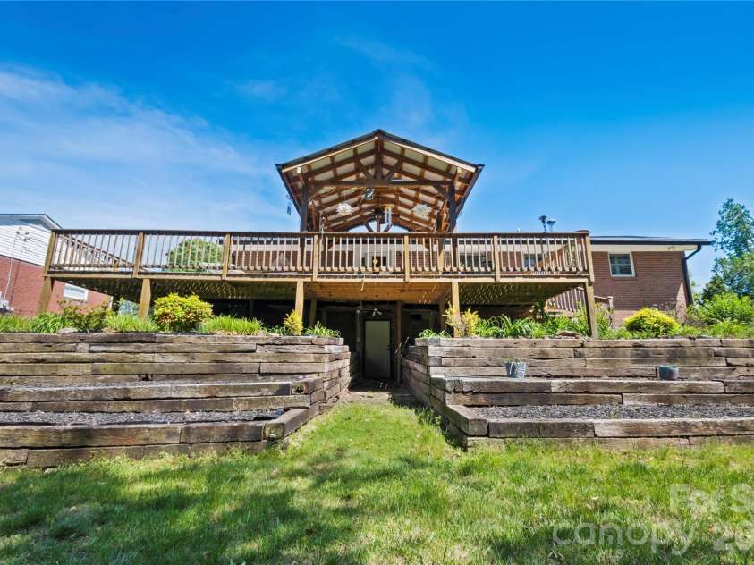 75 Hawthorne Drive, Brevard, NC 28712.  MLS# CAR4384254, YatesRealty ID 24035. Rear Exterior and yard