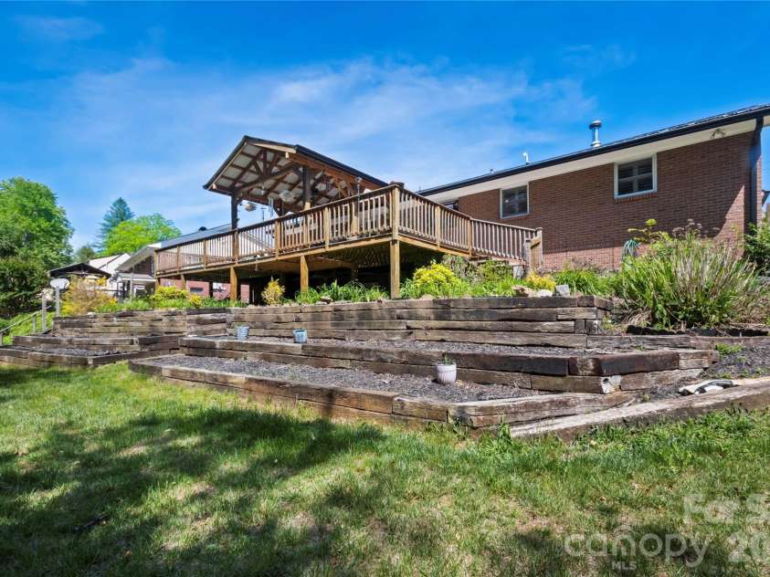 75 Hawthorne Drive, Brevard, NC 28712.  MLS# CAR4384254, YatesRealty ID 24035. Rear Exterior and yard