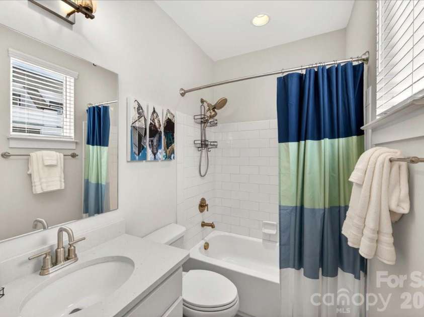 4136 Castleton Road, Charlotte, NC 28211.  MLS# CAR4381124, YatesRealty ID 24040. Guest bathroom #2 with quartz countertops and tiled shower surround.