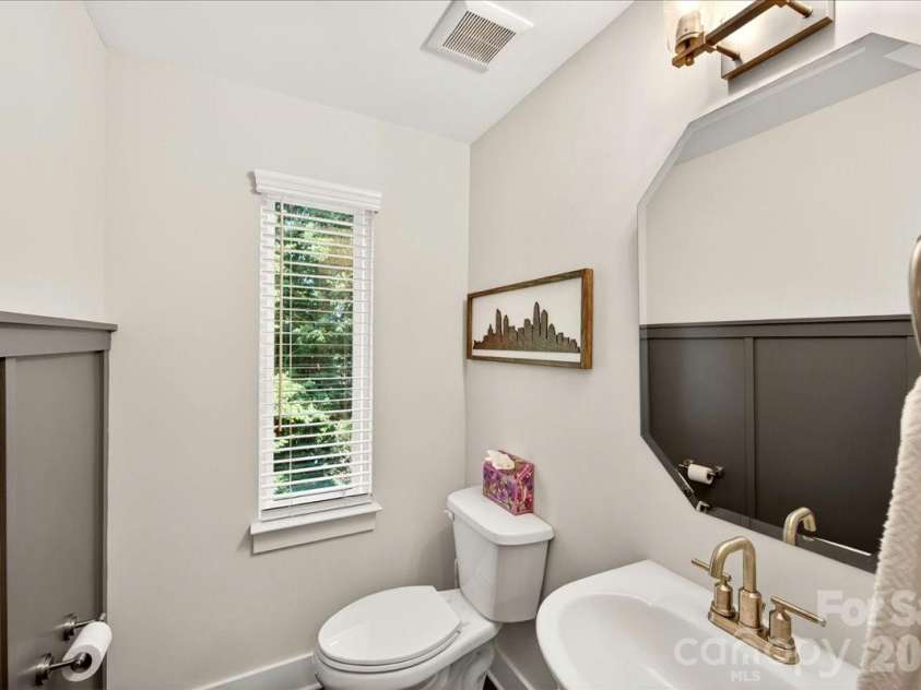 4136 Castleton Road, Charlotte, NC 28211.  MLS# CAR4381124, YatesRealty ID 24040. Half bathroom on the main level with wainscoting and window.