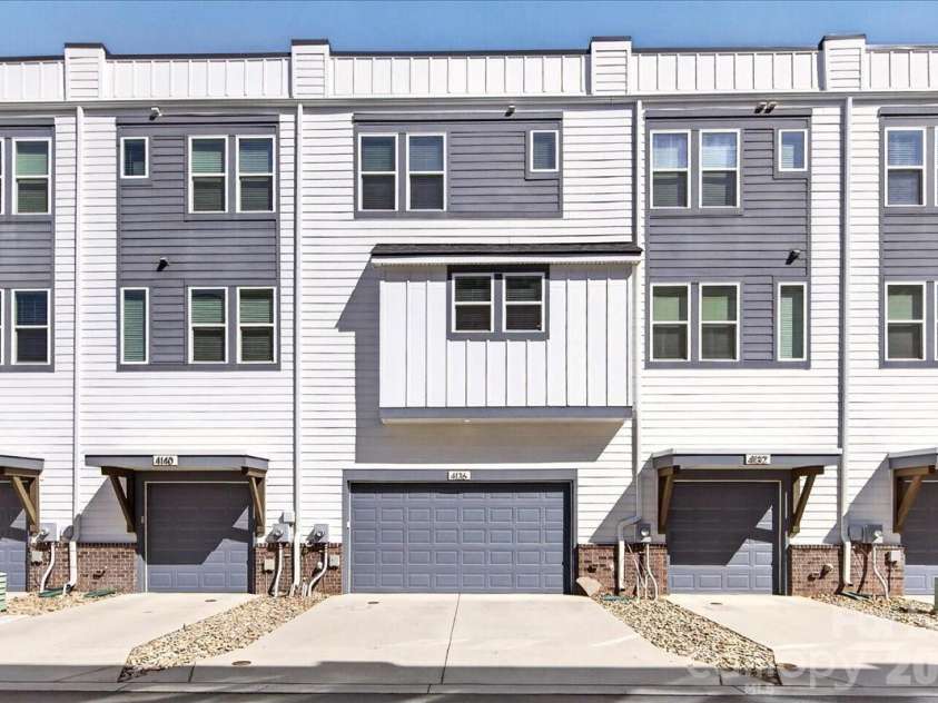 4136 Castleton Road, Charlotte, NC 28211.  MLS# CAR4381124, YatesRealty ID 24040. Large 2-car garage with additional concrete driveway with enough room for 2 cars.