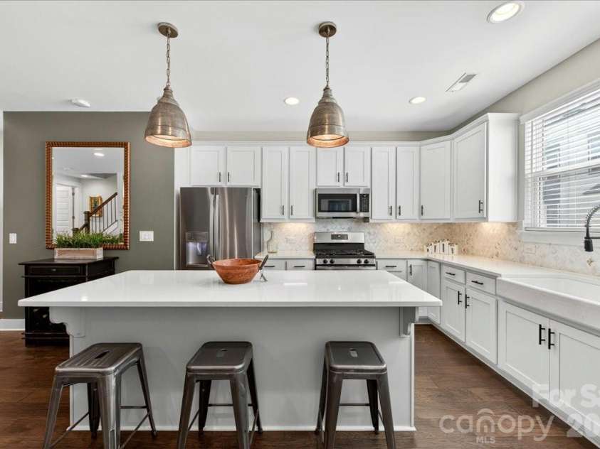 4136 Castleton Road, Charlotte, NC 28211.  MLS# CAR4381124, YatesRealty ID 24040. Large kitchen island and counters feature quartz countertops.