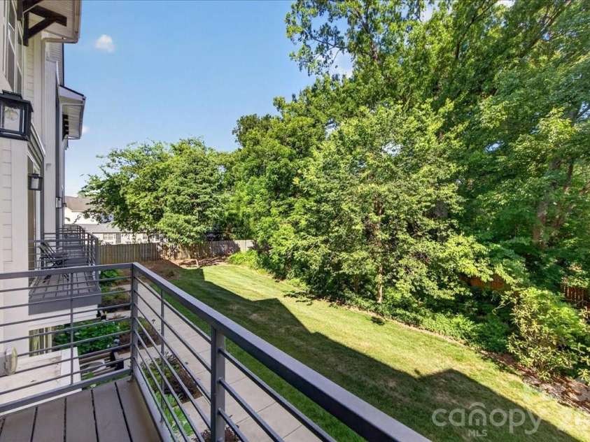 4136 Castleton Road, Charlotte, NC 28211.  MLS# CAR4381124, YatesRealty ID 24040. Main level balcony off great room overlooking the green/common space.