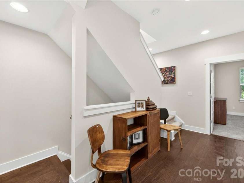 4136 Castleton Road, Charlotte, NC 28211.  MLS# CAR4381124, YatesRealty ID 24040. Third floor landing between the primary and guest bedroom. Laundry is also located here.