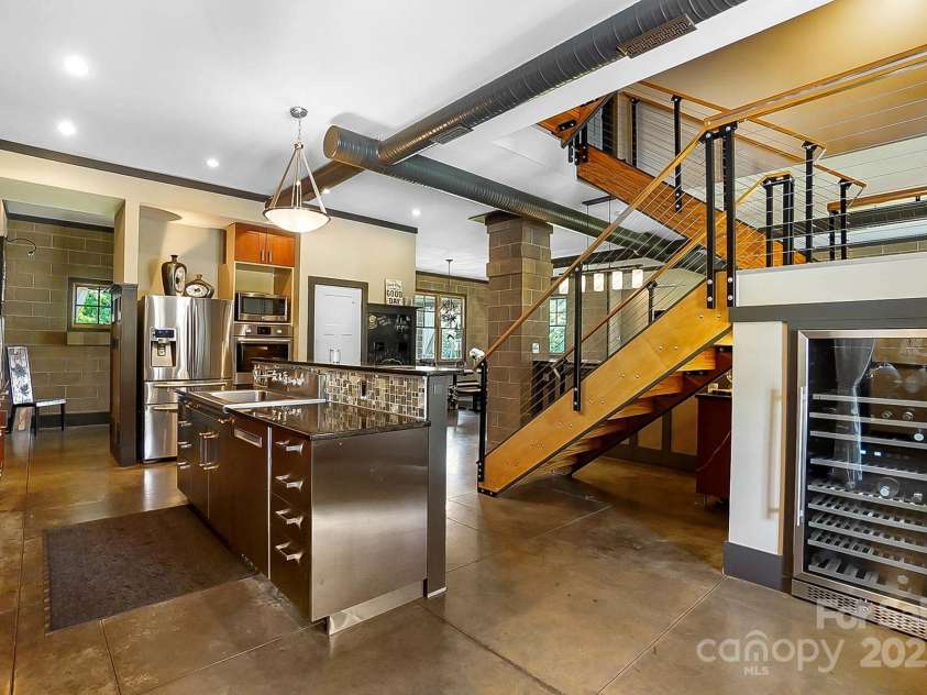 14701 Cabarrus Road, Mint Hill, NC 28227.  MLS# CAR4260366, YatesRealty ID 24046. Kitchen and Wine Fridge