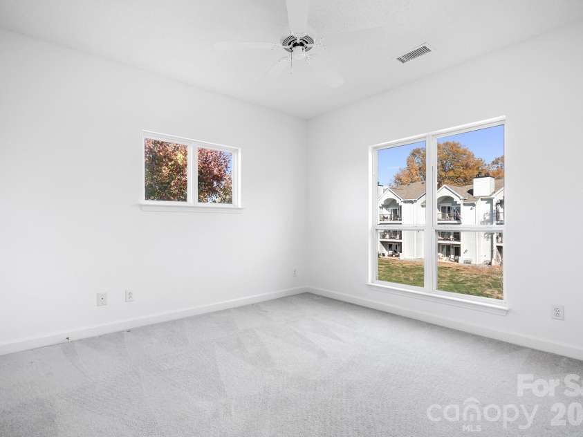 18816 Nautical Drive, Cornelius, NC 28031.  MLS# CAR4321844, YatesRealty ID 2405. Bedroom 2 of 3 Bedrooms. Seller giving $15,000 flooring allowance! Carpet virtually enhanced.